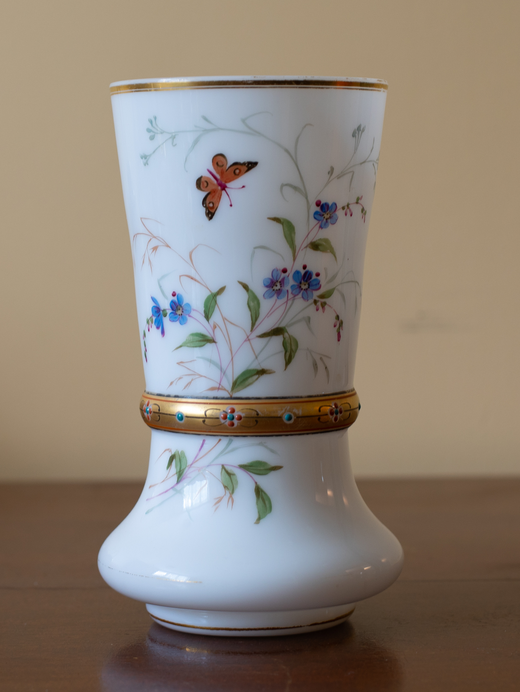Milk glass vase with flower butterfly